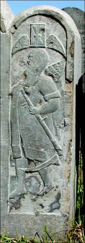 Right border of Tawley stone, with winged hourglass and winged Father Time holding a scythe.